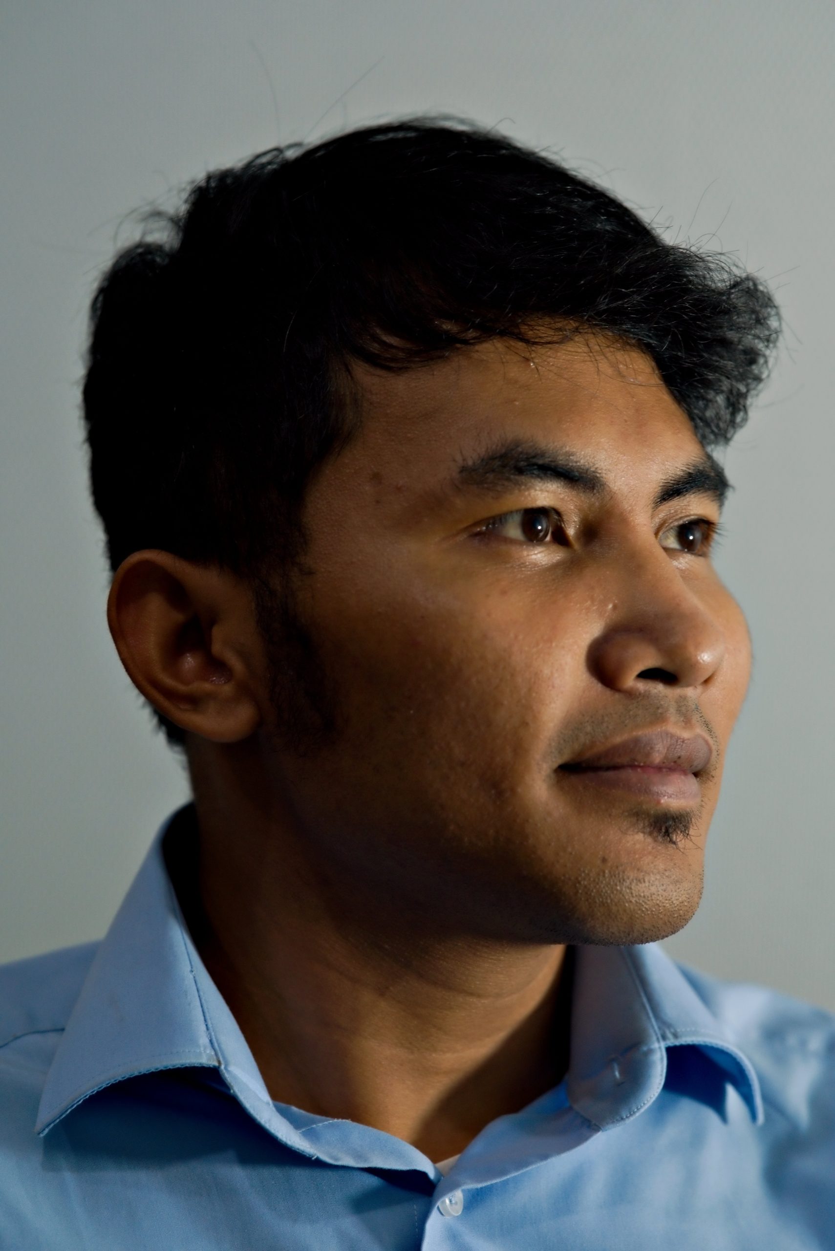 Portrait of a man with black hair.
